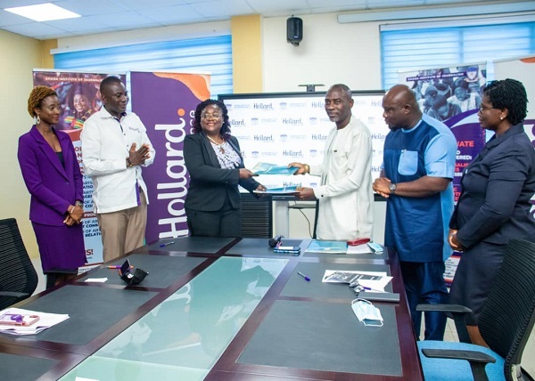 Patience Akyianu (3rd left), the Group Chief Executive Officer of Hollard Ghana, exchanging the signed agreement with Professor Kwamena Kwansah-Aidoo (4th left), the Rector of GIJ Hollard Ghana, GIJ sign MoU to empower students