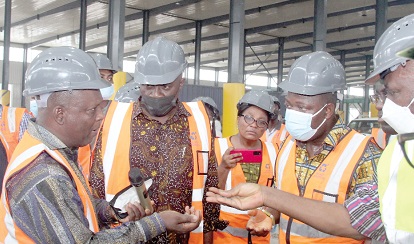 Michael Paid Tuwor (left), MD, Accra Compost and Recycling Plant, speaking with Dan Botwe (middle), Minister for Local Government, Decentralisation and Rural Development, at the compost. With them are some staff from the ministry Michael Paid Tuwor (left), MD, Accra Compost and Recycling Plant, speaking with Dan Botwe (middle), Minister for Local Government, Decentralisation and Rural Development, at the compost. With them are some staff from the ministry