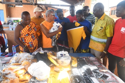 Officials of Sankofa Beach presenting the items to the club Officials of Sankofa Beach presenting the items to the club