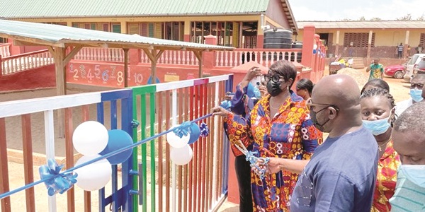 Andrew E. Mercer- a Deputy Minister, joined by Cynthia Lumor- Deputy MD, Tullow to cut the tape to commission the school Tullow completes sustainable kindergarten projects