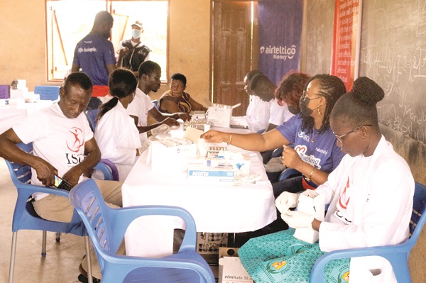 Some of the community members going through the sickle-cell disease checking procedure during the health screening exercise AirtelTigo, ISCC hold sickle cell sensitisation exercise