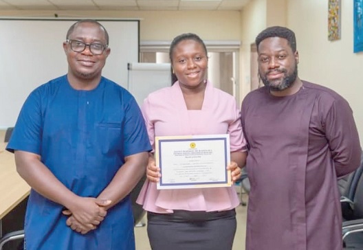 Ernest Apenteng (left), General Manager, Clare Agyekum Mensah (middle), General Administration Manager, Cornelis Rouloph-Otoo (right), Head of Legal and Corporate Affairs, displaying the certificate from BoG Ernest Apenteng (left), General Manager, Clare Agyekum Mensah (middle), General Administration Manager, Cornelis Rouloph-Otoo (right), Head of Legal and Corporate Affairs, displaying the certificate from BoG