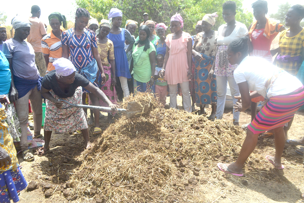 The women being taken through the organic compost production The women being taken through the organic compost production