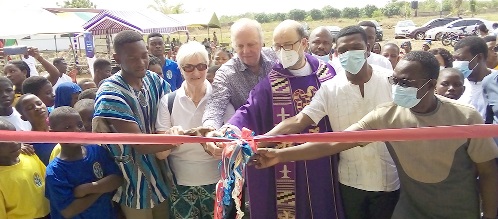 Rev. Fr. Bernard Heistakamp (3rd from right), Aktion-Lichtblicke-E. V. Ghana, being assisted by Richmond Tetteh Agamlorh (left), the acting Director of Rays of Hope Centre and other dignitaries to cut the tape to commission the facilities Rev. Fr. Bernard Heistakamp (3rd from right), Aktion-Lichtblicke-E. V. Ghana, being assisted by Richmond Tetteh Agamlorh (left), the acting Director of Rays of Hope Centre and other dignitaries to cut the tape to commission the facilities