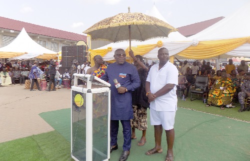 Seth Kwame Acheampong (with mic), Eastern Regional Minister, addressing the festival Seth Kwame Acheampong (with mic), Eastern Regional Minister, addressing the festival