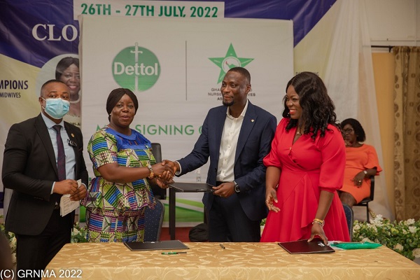 Perpetual Ofori Ampofo (2nd left), the President of GRNMA, exchanging the document with Henry Ankrah (2nd right), the Country Sales Manager for Reckitt, after the signing Two institutions partner to promote good hygiene