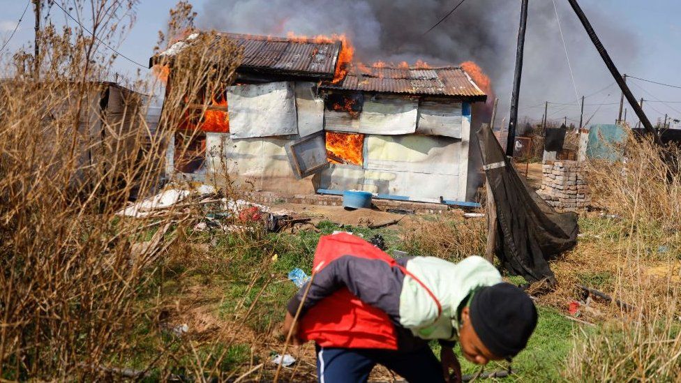 The homes belonging to people suspected of being in the country illegally were set alight The homes belonging to people suspected of being in the country illegally were set alight
