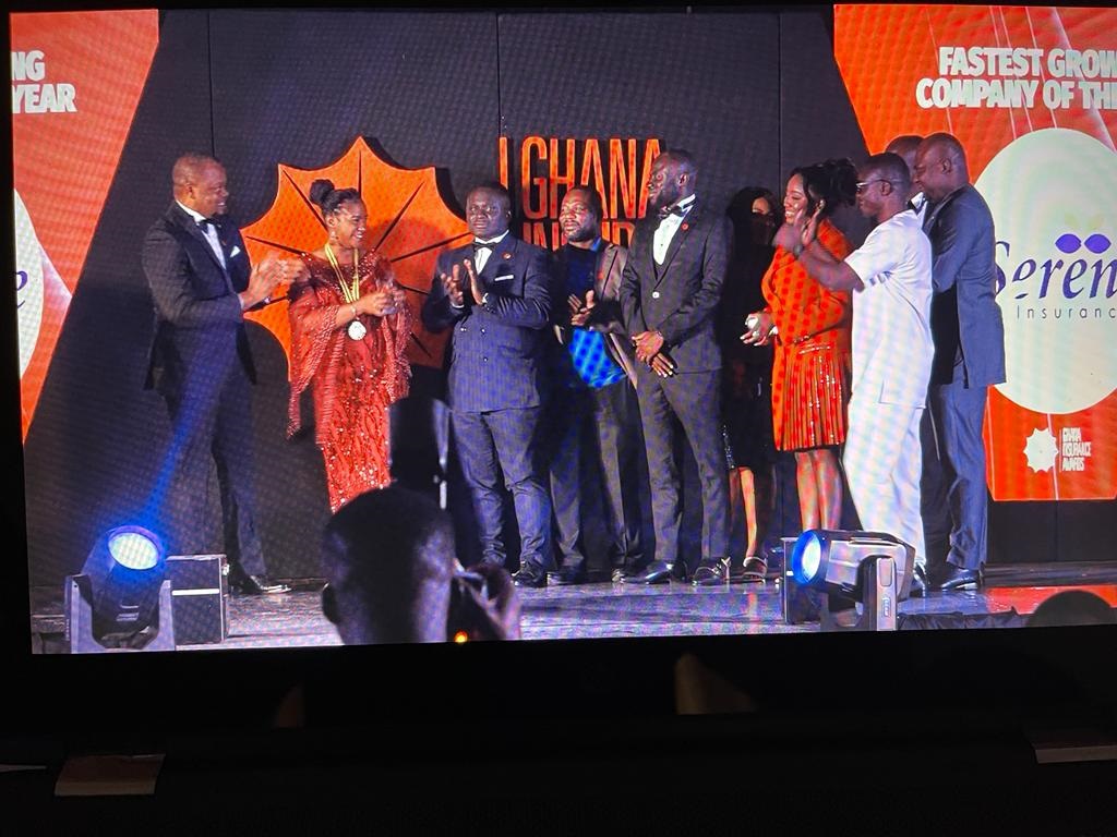 The Serene Insurance team led by the Head of Marketing, Mrs. Agyire-Tettey applauding after receiving the award Serene Insurance recognized as Fastest Growing Insurance Company