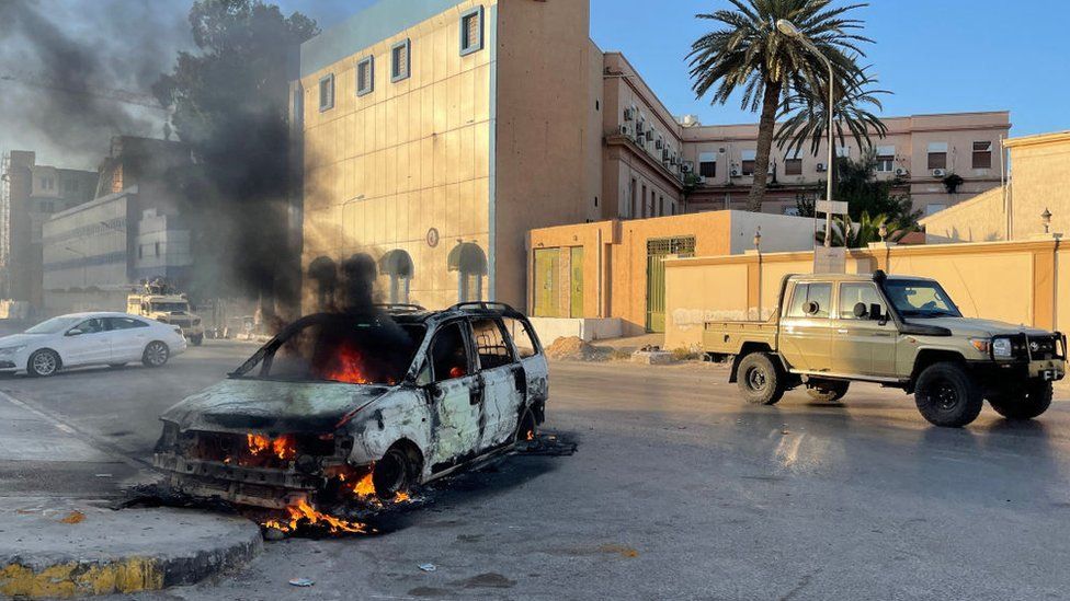 A damaged vehicle in Tripoli on Saturday UN calls for Libya ceasefire after deadly clashes
