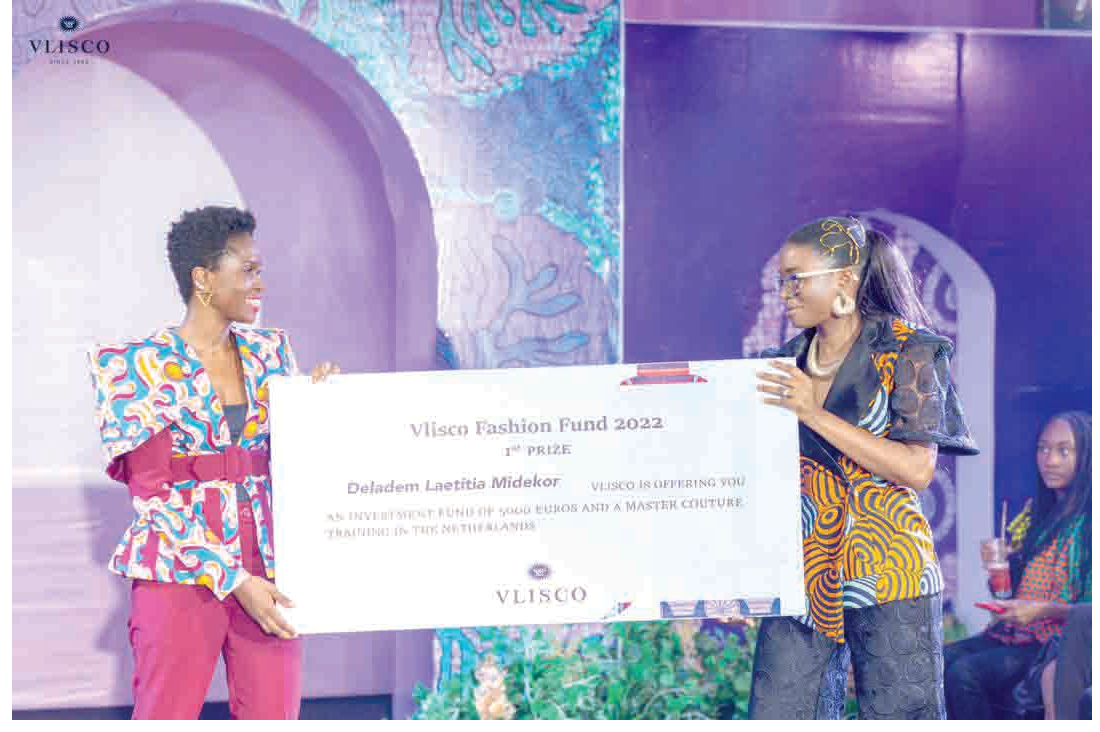 Fatoumata Doro (left), Managing Director of Texstyles Ghana Ltd, presenting a dummy cheque to Deladem Midekor, the overall winner of the 2022 Vlisco Fashion Fund Vlisco commits €7.3m to environmental, social issues
