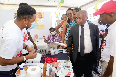 Kwaku Agyeman-Manu (right), Minister of Health, inspecting an item at an exhibition at the 2022 World Aids Day in Accra. With him are Dr Leticia Adelaide Appiah (3rd from right), Executive Director of the National Population Council, and others. Picture: GABRIEL AHIABOR Kwaku Agyeman-Manu (right), Minister of Health, inspecting an item at an exhibition at the 2022 World Aids Day in Accra. With him are Dr Leticia Adelaide Appiah (3rd from right), Executive Director of the National Population Council, and others. Picture: GABRIEL AHIABOR
