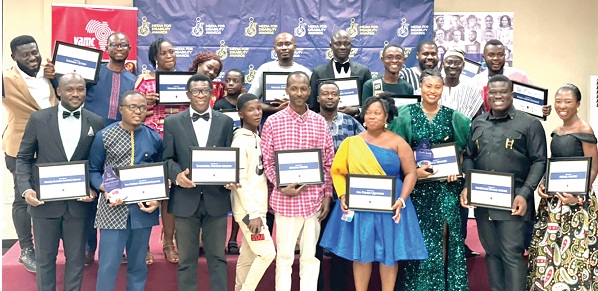 Participants in the workshop displaying their certificates at the close of the event Participants in the workshop displaying their certificates at the close of the event