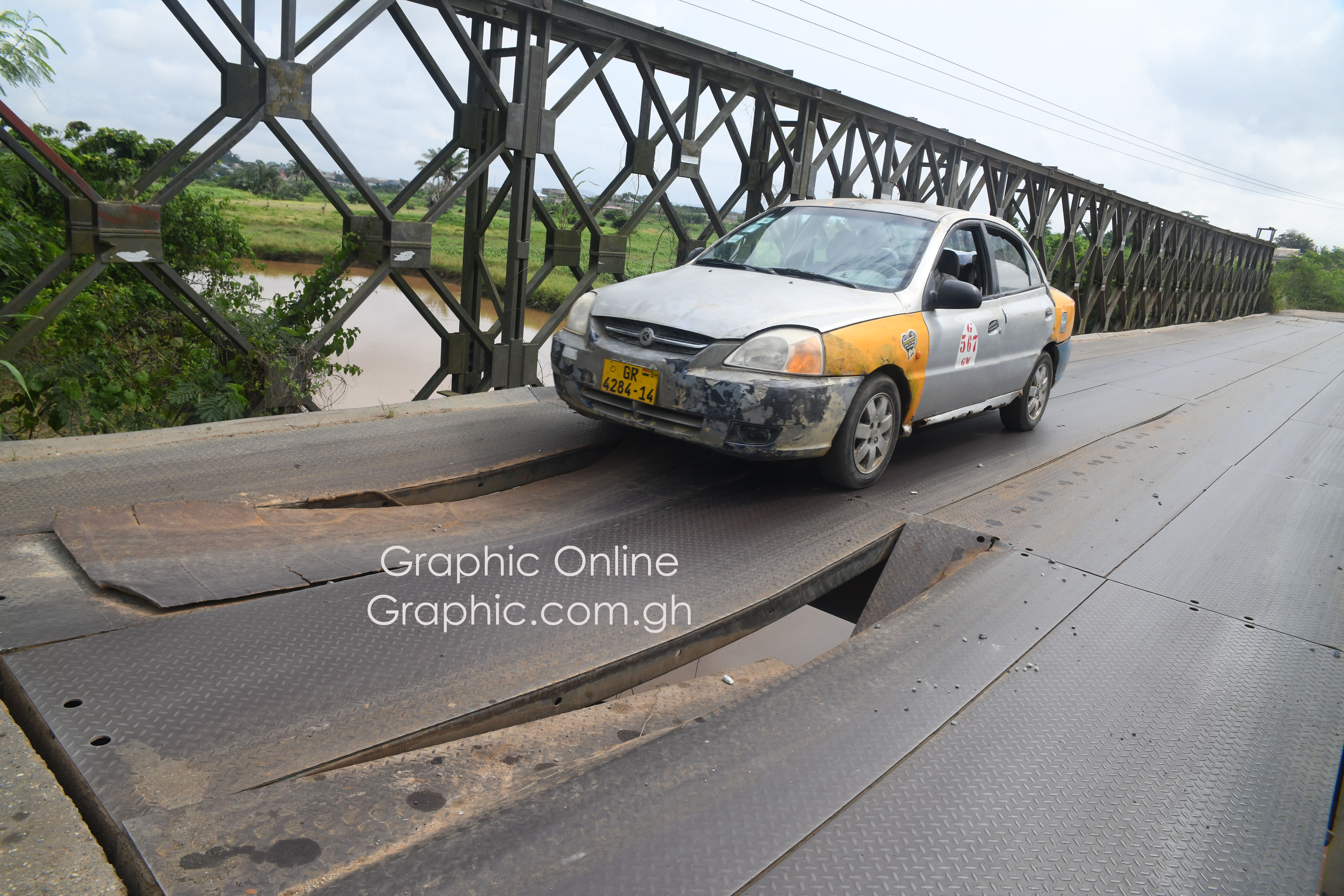The collapsing bridge over River Densu The collapsing bridge over River Densu