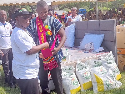 Dr Archbald Yao Letsa (left), Volta Regional Minister, decorating the 2022 Volta Regional Best Farmer, Vozbeth Kofi Azumah Dr Archbald Yao Letsa (left), Volta Regional Minister, decorating the 2022 Volta Regional Best Farmer, Vozbeth Kofi Azumah