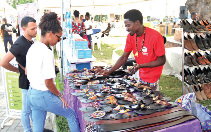 Some foreigners patronising locally made Justice Barbara Frances Ackah-Yensu Justice Samuel Kwame Adu Asiedu sandals at the fair at AMA in Accra