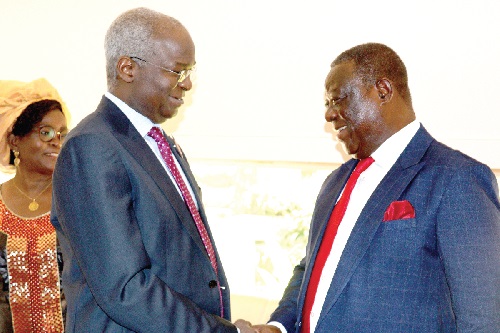 Kwasi Amoako-Atta (right), Minister of Roads and Highways, exchanging pleasantries with Babatunde Raji Fashola San, the Nigerian Minister of Works and Housing 