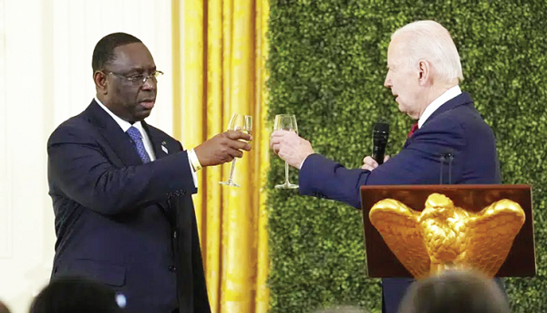 Joe Biden toasting with Macky Sall, AU Chairman, in the East Room of the White House during the U.S.-Africa Leaders Summit dinner Joe Biden toasting with Macky Sall, AU Chairman, in the East Room of the White House during the U.S.-Africa Leaders Summit dinner
