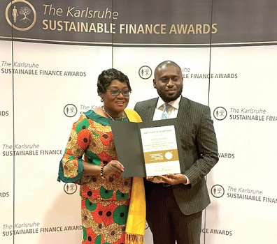 Gina Blay (left), Ghana’s Ambassador to Germany, and John Akuoko-Tawiah, Head, Sustainability and Climate Finance at DBG, displaying the award Gina Blay (left), Ghana’s Ambassador to Germany, and John Akuoko-Tawiah, Head, Sustainability and Climate Finance at DBG, displaying the award