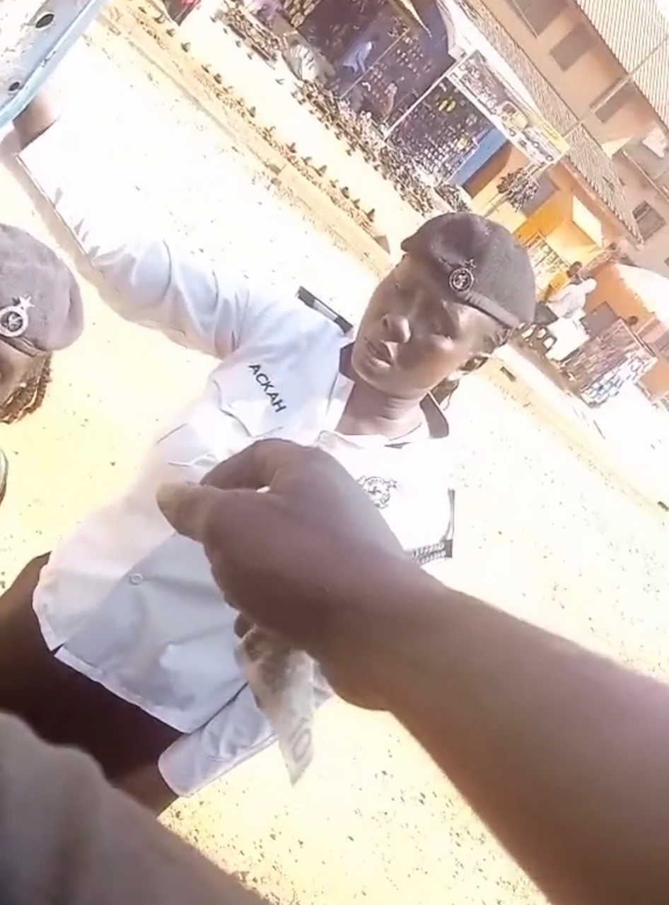 Two MTTD police women seen collecting GH¢10 from driver interdicted Two MTTD police women seen collecting GH¢10 from driver interdicted