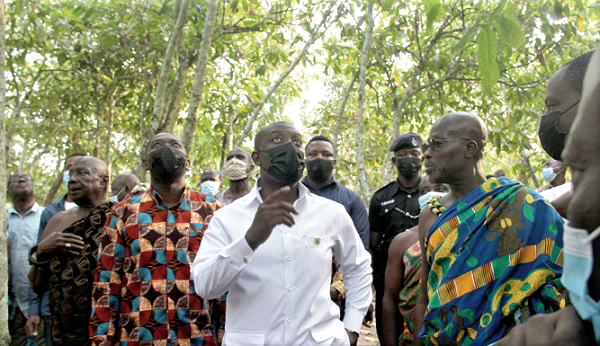 Mr Kojo Oppong Nkrumah (middle), Minister of Information, touring the late Tettteh Quarshie’s first cocoa farm at Akuapem Mampong. He was led by Osaberima Kwame Ottu Darte III, Chief of Akuapem Mampong (right). With them is Mr Herbert Krapa (2nd from left), Deputy Minister, Trade and Industry. Picture: BENEDICT OBUOBI Mr Kojo Oppong Nkrumah (middle), Minister of Information, touring the late Tettteh Quarshie’s first cocoa farm at Akuapem Mampong. He was led by Osaberima Kwame Ottu Darte III, Chief of Akuapem Mampong (right). With them is Mr Herbert Krapa (2nd from left), Deputy Minister, Trade and Industry. Picture: BENEDICT OBUOBI