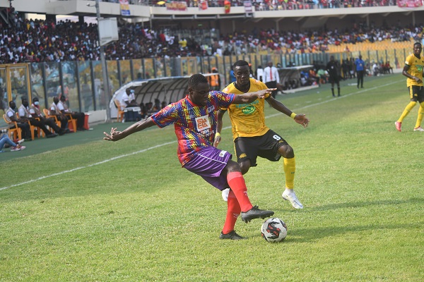 Heart's Dennis Korsah(left) shields the ball away from George Mfegue of Kotoko. Heart's Dennis Korsah(left) shields the ball away from George Mfegue of Kotoko.