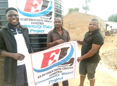 Flashback: Joshua Anim ,treasurer Ada Youth For Devlopment, (AYFD), left, holds the association's banner with James Tsiani Gadugah (centre) and a member of the asociation Flashback: Joshua Anim ,treasurer Ada Youth For Devlopment, (AYFD), left, holds the association's banner with James Tsiani Gadugah (centre) and a member of the asociation