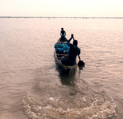 A victim of child labour fishing on the volta lake with an adult