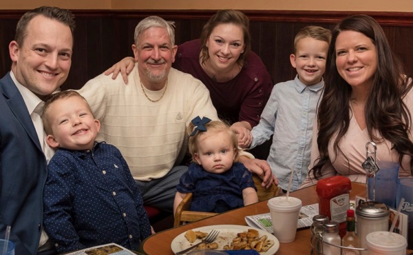 David Bennett (third left) poses for a picture with his family. Doctors transplanted a pig heart into Bennett in a last-ditch effort to save his life and said he was doing well three days after the surgery [Byron Dillard via AP Photo]