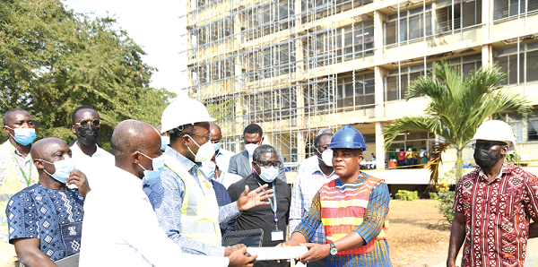 Dr Opoku Ware Ampomah (3rd from left), CEO of KBTH, being assisted by Dr Patrick Bankah (2nd from left), MD of Neurosurgeon, KBTH to hand over the contract document to Mr Francis Sorkpah (right), MD of Katalon Ghana Limited. Dr Opoku Ware Ampomah (3rd from left), CEO of KBTH, being assisted by Dr Patrick Bankah (2nd from left), MD of Neurosurgeon, KBTH to hand over the contract document to Mr Francis Sorkpah (right), MD of Katalon Ghana Limited.
