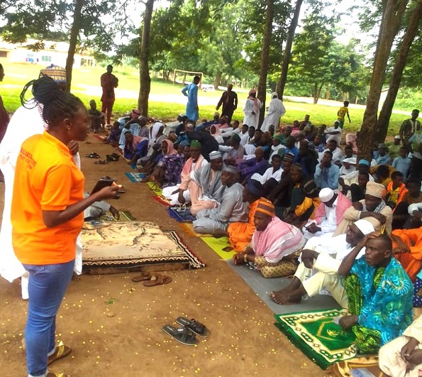 A nurse, Grace Ujan (standing) addressing the Eid celebrants. Humanity, Nature Trust brings Muslims and Christians together