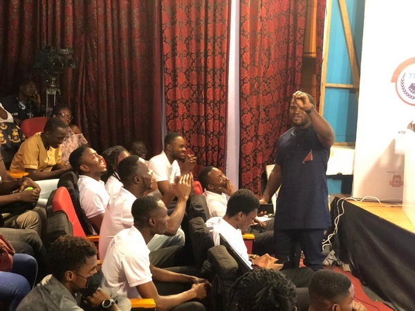 Some members of the audience cheering their teams during the competition Graphic Tertiary Business Sense Challenge: 3 Schools in grand finale