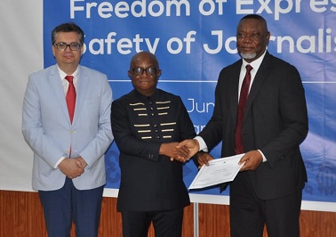 Dr Archibald Yao Letsa (middle), the Volta Regional Minister, presenting a certificate to Justice Senyo Dzamefe, a judge of the Court of Appeal. With them is Professor Joan Barata Mir, an international human rights expert and resource person 