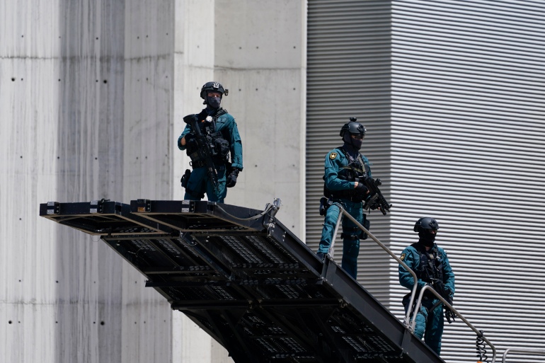 Security stands guard at Madrid's Torrejon Airport on June 28, 2022, as world leaders arrive for the NATO summit [Susan Walsh/AP]
