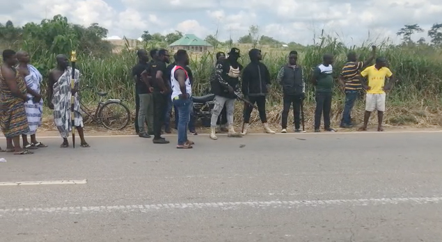 A group of young men bearing arms seen with the delegation from the Anhwiaso Traditional Area