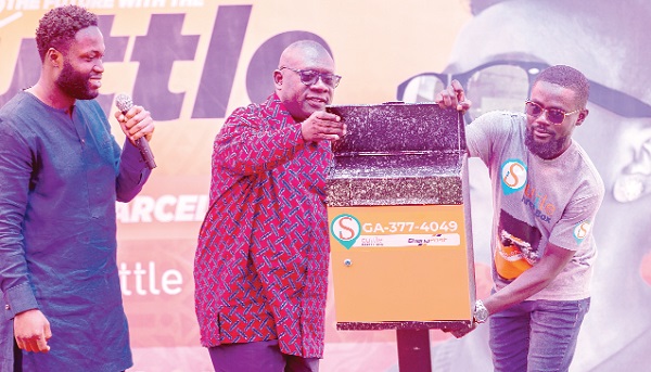O.B. Amoah (middle), Deputy Minister of Local Government, Decentralisation and Rural Development, observing the scuttle box