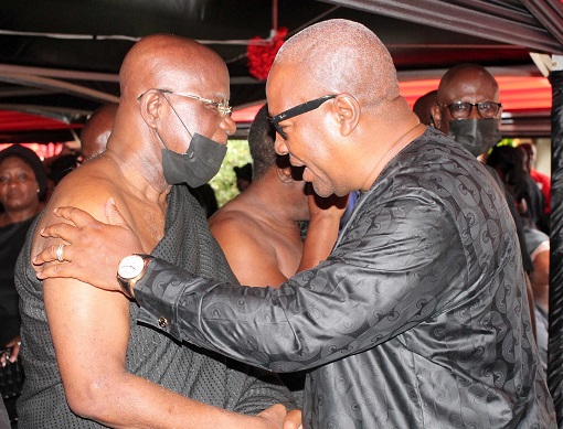 Former President John Mahama (right) commiserating with Hackman Owusu-Agyemang 