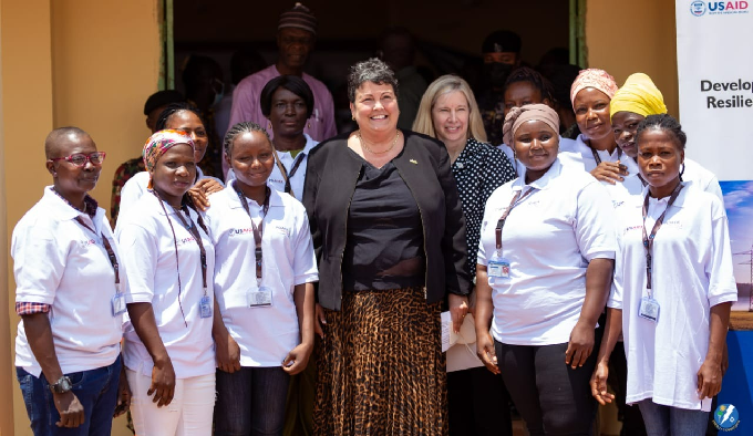 US Ambassador to Ghana, Her Excellency Virginia Palmer and the Mission Director, USAID/Ghana, Kimberly Rosen in a picture with the 10 female electrical wiring professionals who benefited from the USAID Wiring Artisans Scholarship Program