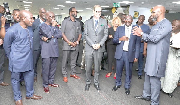 Ralph Mupita, Group President and CEO of MTN, explains a point to the dignitaries