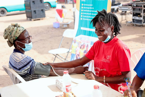 A nurse checking the vital statistics of a patient at the event