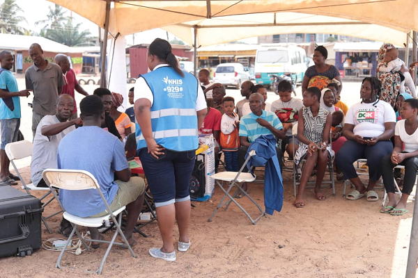 NHIS officials registering people at the event