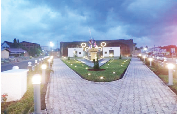 Sculptured  fishermen drawing a seine net at the Akosua Village