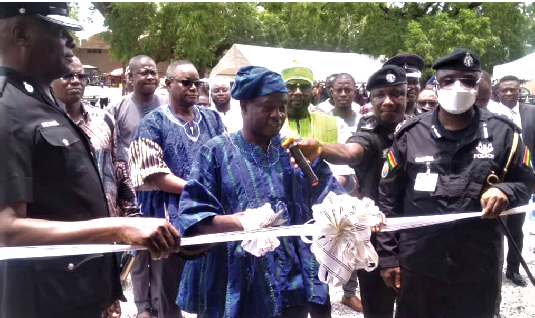 Stephen Yakubu (middle), Upper East Regional Minister, cutting the tape to inaugurate the facility. Looking on are DCOP Dr Sayibu Pabi Gariba (right), immediate past Upper East Regional Police Commander, and Chief Superintendent Dela Dzansi (left), Bolgatanga Divisional Police Commander Stephen Yakubu (middle), Upper East Regional Minister, cutting the tape to inaugurate the facility. Looking on are DCOP Dr Sayibu Pabi Gariba (right), immediate past Upper East Regional Police Commander, and Chief Superintendent Dela Dzansi (left), Bolgatanga Divisional Police Commander