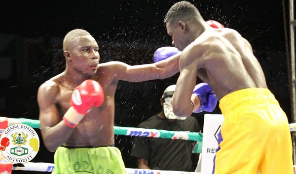 Musah Lawson connects to the jaw of his Lesko Sossiya (right) on his way to retaining his title last Saturday night Musah Lawson connects to the jaw of his Lesko Sossiya (right) on his way to retaining his title last Saturday night