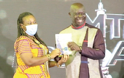 Kwabena Yeboah presenting an award to Ama Amankwa Baafi