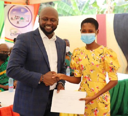 Mr. Prince Sefah, Administrator of GIFEC presenting to a certificate one of the participants