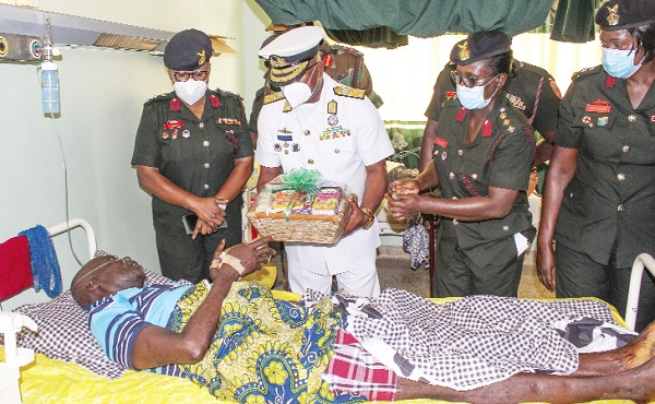 Vice-Admiral Seth Amoama, Chief of the Defence Staff, presenting items to a soldier on admission at the 37 Military Hospital. Picture: ERNEST KODZI Vice-Admiral Seth Amoama, Chief of the Defence Staff, presenting items to a soldier on admission at the 37 Military Hospital. Picture: ERNEST KODZI
