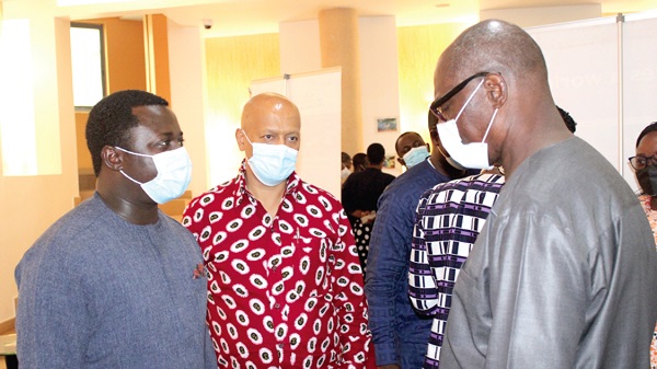 Rev. John Ntim Fordjour (left), Deputy Education Minister, interacting with Mr Dickens Thunde (right), Director of World Vision Ghana, as Mr Solomon Tesfamariam (middle), Country Director of Plan International, looks on