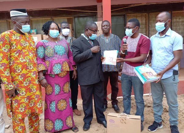 Evans Atim (second-right), Project Manager of Right To Play presenting the items to Dr Peter Attafuah (extreme left), Regional Education Directorator,looking on are some officials of the NGO and GES Evans Atim (second-right), Project Manager of Right To Play presenting the items to Dr Peter Attafuah (extreme left), Regional Education Directorator,looking on are some officials of the NGO and GES