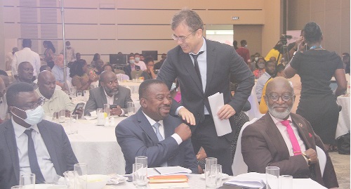 Sukhrob Khoshmukhamedov, Deputy UNDP Resident Representative in Ghana, being congratulated by Stephen Yaw Osei, Director of Policy Planning, Monitoring and Evaluation, Ministry of Works and housing. With them is Yofi Grant (seated right), Chief Executive Officer, GIPC Sukhrob Khoshmukhamedov, Deputy UNDP Resident Representative in Ghana, being congratulated by Stephen Yaw Osei, Director of Policy Planning, Monitoring and Evaluation, Ministry of Works and housing. With them is Yofi Grant (seated right), Chief Executive Officer, GIPC