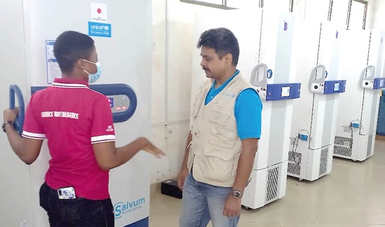 Gladys Siuetey, a Cold Room Manager, taking Dr Mrunal Shetye, Chief of Health and Nutrition, UNICEF Ghana, through the operations of the storage machine Gladys Siuetey, a Cold Room Manager, taking Dr Mrunal Shetye, Chief of Health and Nutrition, UNICEF Ghana, through the operations of the storage machine